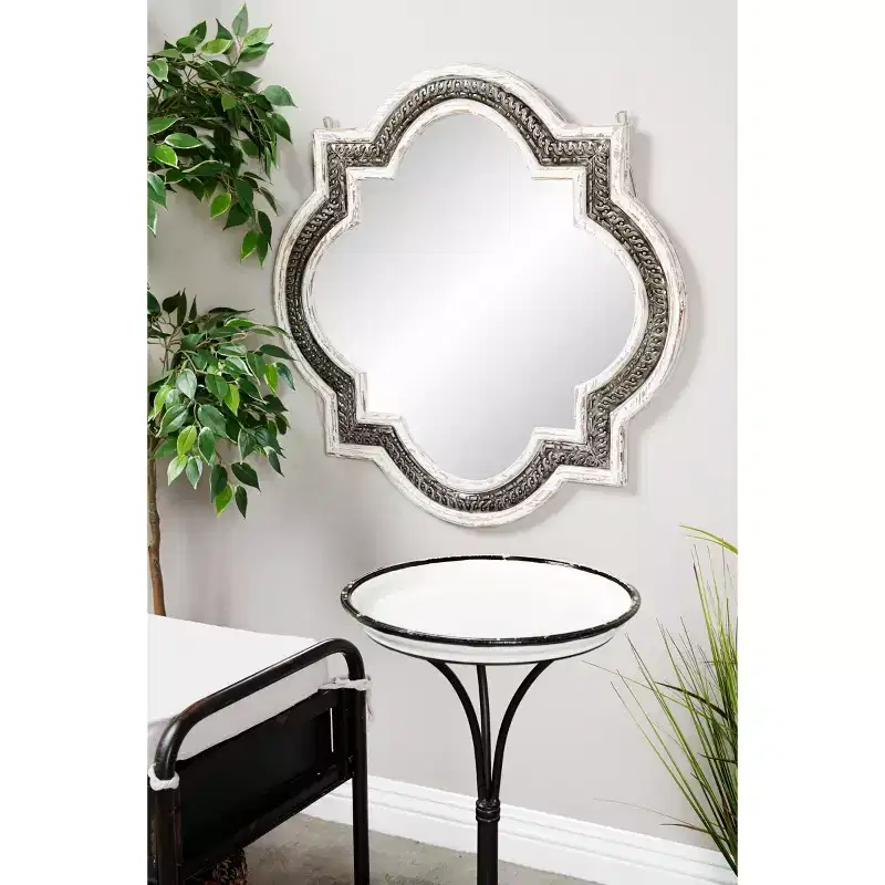 White wooden four-leaf clover wall mirror with Baroque wrought iron inlay; no assembly required.